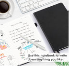Black notebook on a desk with a cup of coffee, pen, and open notebook with writing and diagrams.
