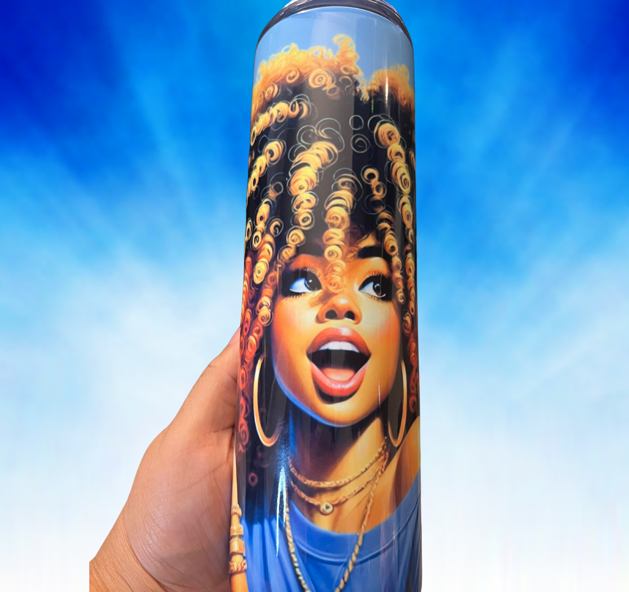 Handheld view showing tumbler’s glossy finish, golden curls, and expressive confident face art.