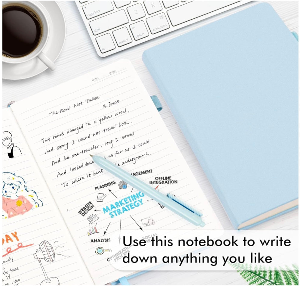 Light blue notebook with a pen on a desk with a coffee cup and keyboard.