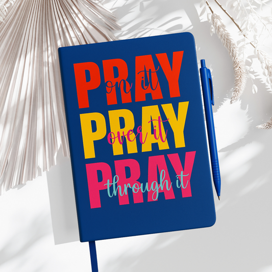 Blue hardcover Pray On It. Pray Over It. Pray Through It. Journal with elastic strap, pen loop, and dual bookmarks for faith journaling