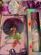 Pink afro-inspired journal and matching insulated tumbler arranged in decorative gift box with bow and filler