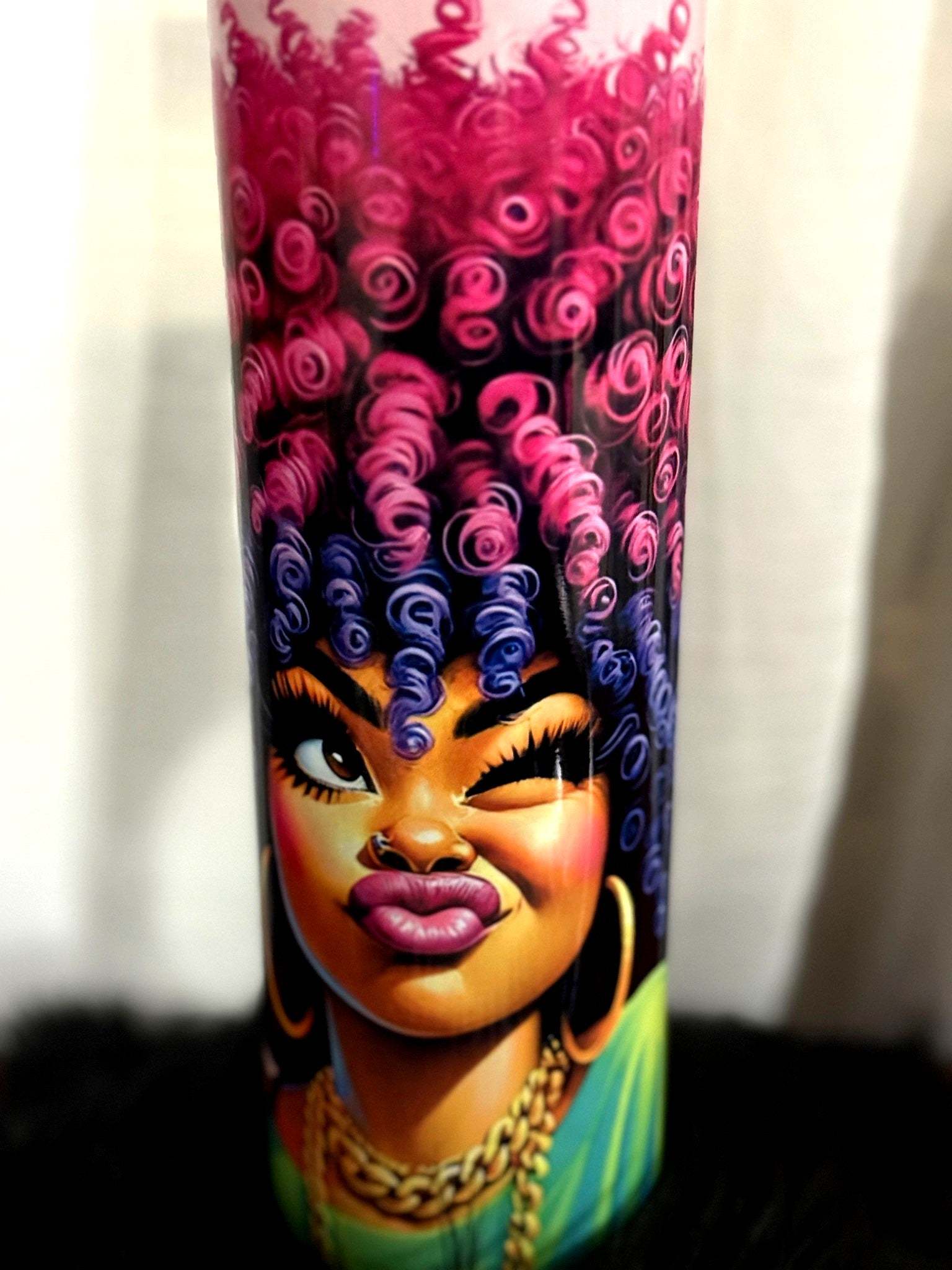 Tumbler with bold female art.