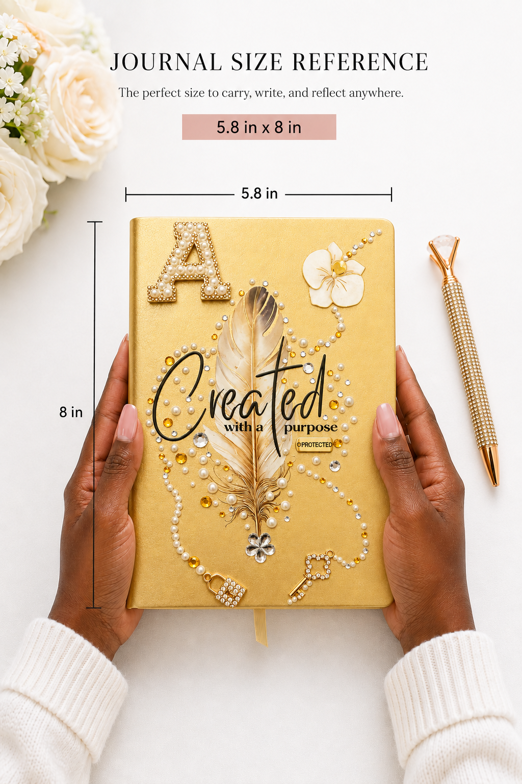 Covered in Grace journal with a warm golden cover, jeweled feather, floral details, gold lettering, and sparkling cross