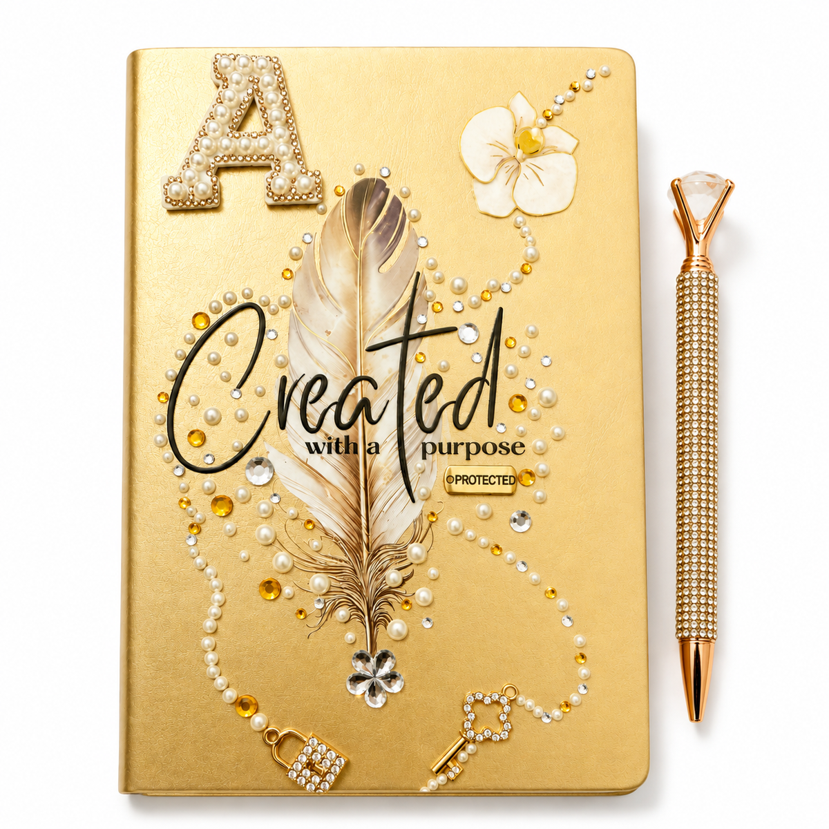 Created With a Purpose gold handcrafted journal with feather artwork, pearl and rhinestone embellishments, and crystal bling pen