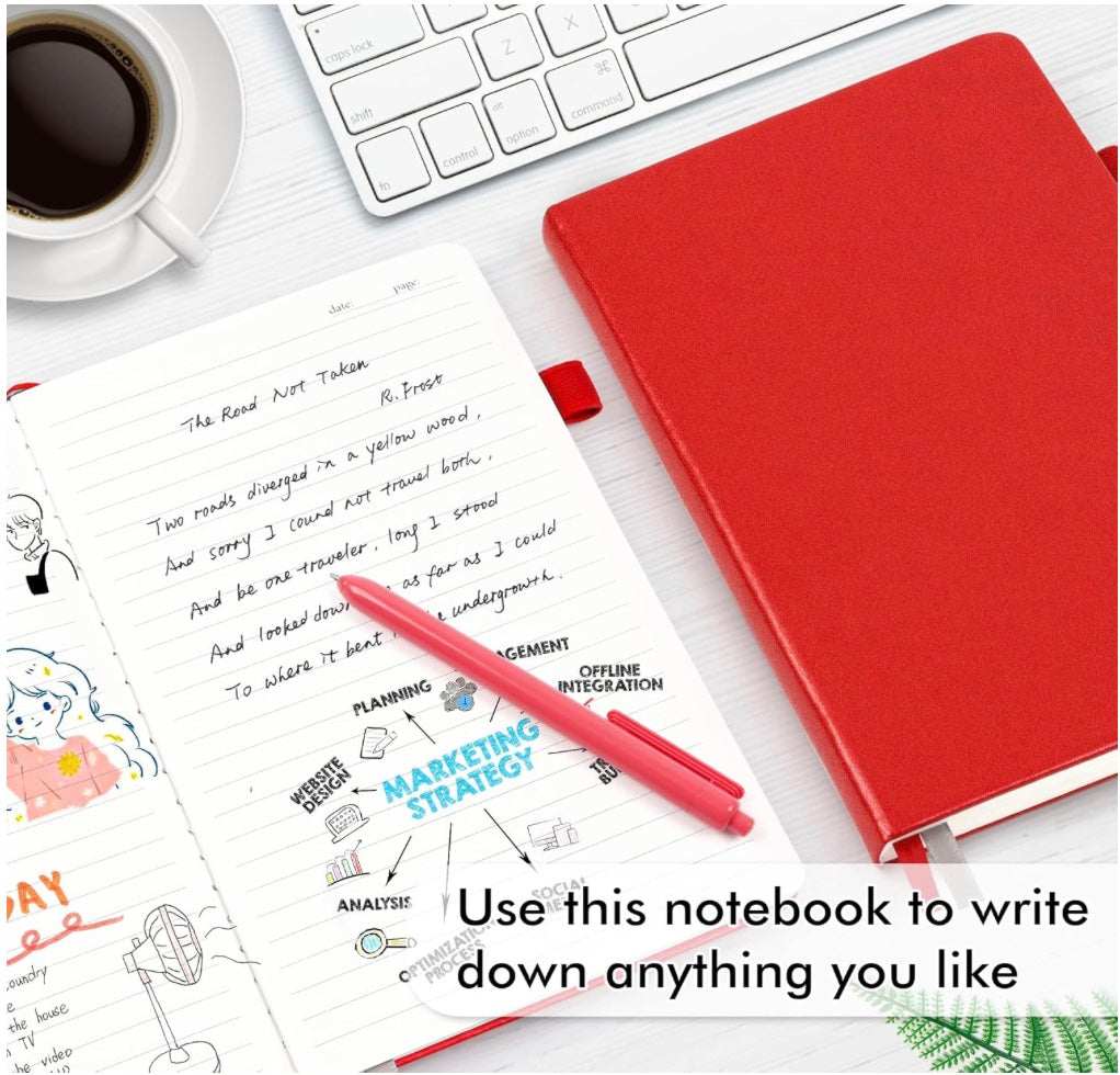 Created With a Purpose red hardcover journal with a matching elastic strap, shown beside an open lined notebook and red pen