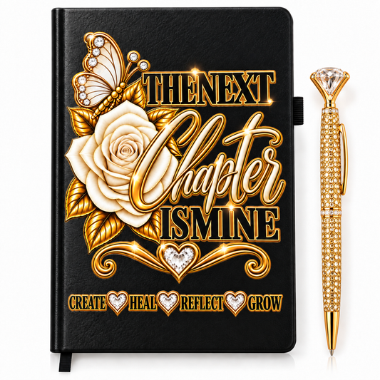 The Next Chapter Is Mine Journal in black textured cover with gold lettering, white rose, heart accents, and rhinestone pen