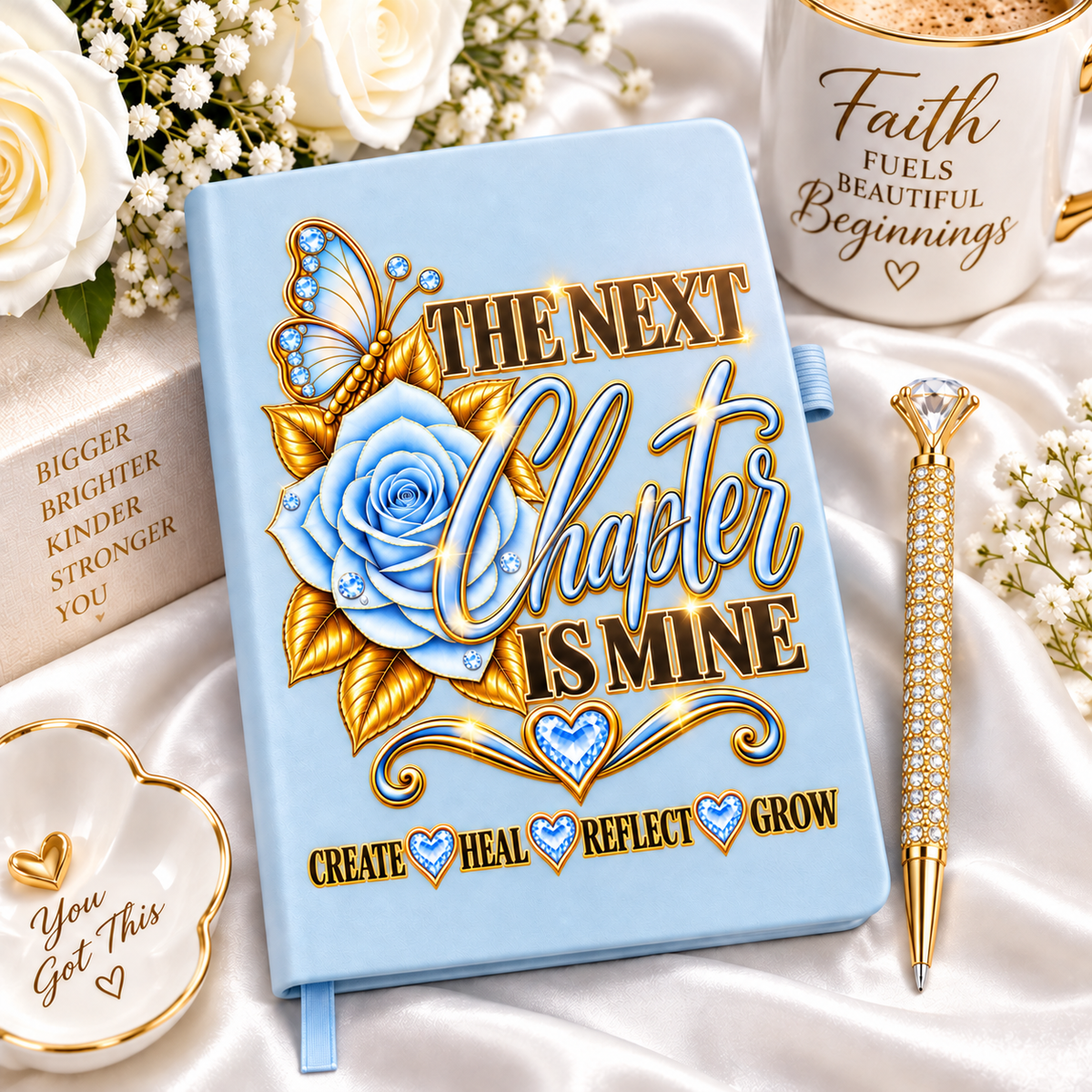 The Next Chapter Is Mine Journal in powder blue with blue rose, jeweled butterfly, gold lettering and matching crystal pen